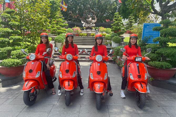 Beautiful Female Riders Vespa Red River Countryside Tour 5 Hours - Leaving Hanoi via Long Bien Bridge