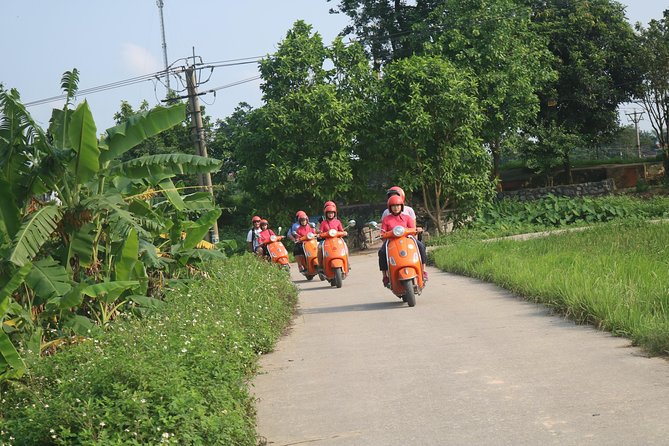 Hanoi Vespa Full Day City & Countryside with Female Ao Dai Riders - West Lake, Huu Hiep Lake, and the B52 crash site