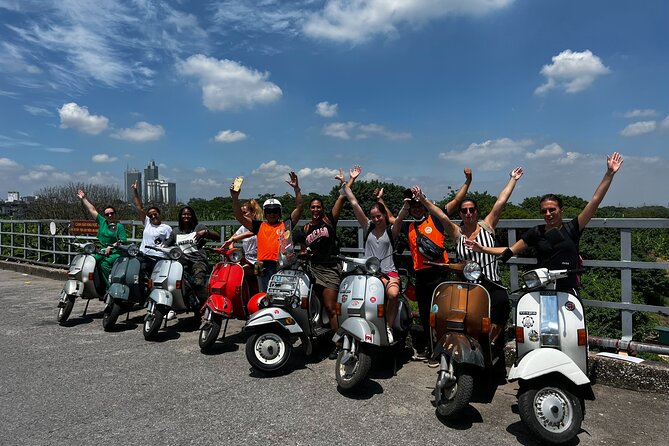 Vespa Tour HANOI BACK STREETS: FOOD+LOCAL LIFE+CULTURE & FUN - Mosaic walls, West Lake, and the B52 at Huu Tiep Lake